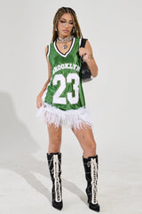 RUN THE COURT JERSEY MINI DRESS WITH FEATHER TRIM IN GREEN