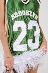 RUN THE COURT JERSEY MINI DRESS WITH FEATHER TRIM IN GREEN