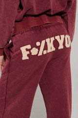 GRAPHIC LANGUAGE MINERAL WASH SWEAT PANT IN BURGUNDY