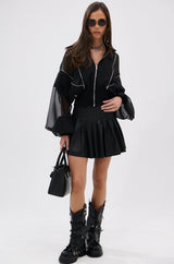 RIO PLEATED FAUX LEATHER MINI SKIRT WITH 4 WAY STRETCH
