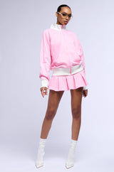 CALL ME BABY PLEATED MINI SKIRT IN PINK