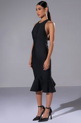 HEIRESS SLEEVELESS PEPLUM DRESS IN BLACK