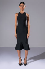 HEIRESS SLEEVELESS PEPLUM DRESS IN BLACK