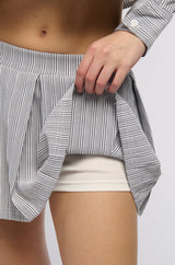 LEAVE IT BETTER PLEATED MINI SKIRT