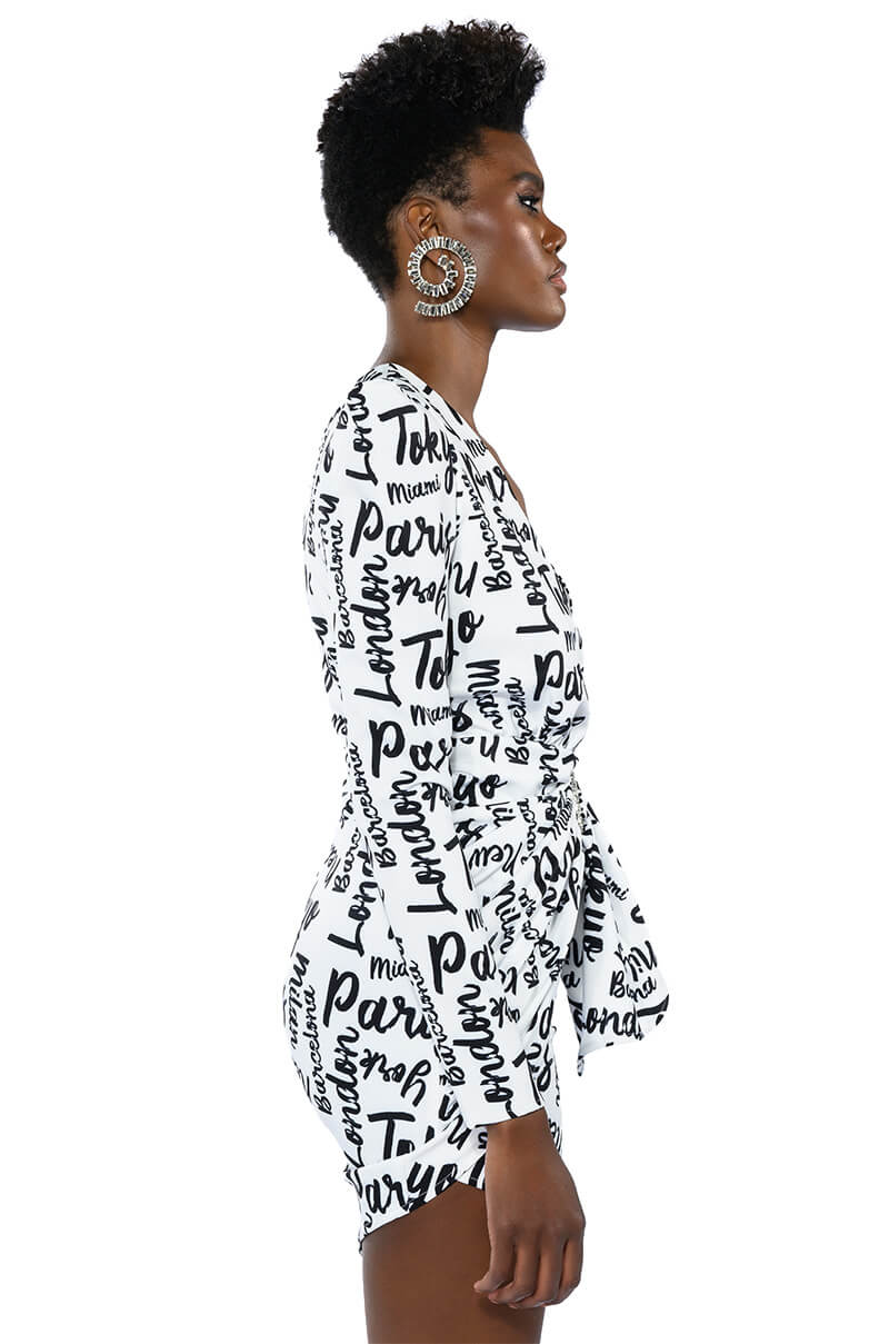 PASSPORT TO EVERYWHERE RUCHED LONG SLEEVE MINI DRESS