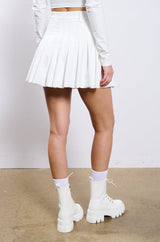 RIO PLEATED FAUX LEATHER MINI SKIRT IN WHITE