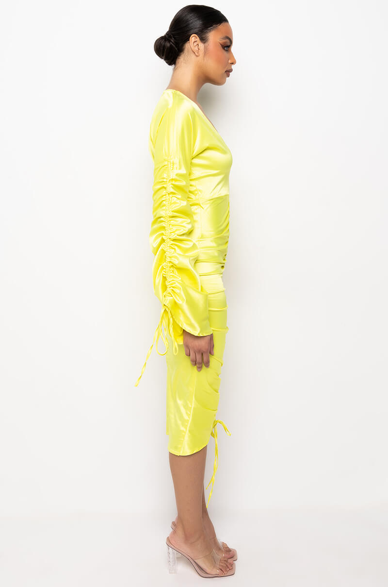 TALK ABOUT IT LOW V NECK RUCHED MIDI DRESS