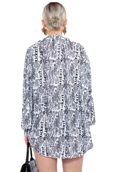 THAT NEW NEWS PRINTED PLEATED TIE FRONT BLOUSE