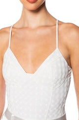 VIBING HOLOGRAPHIC FAUX LEATHER BODYSUIT IN WHITE