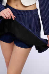 WHATS THE TEA PINSTRIPE PLEATED MINI SKIRT IN NAVY