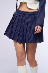 WHATS THE TEA PINSTRIPE PLEATED MINI SKIRT IN NAVY